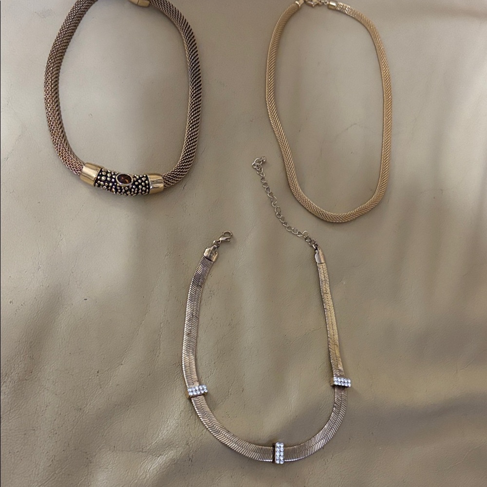 Ladies 3 gold tone necklaces, 1 gold mesh w/amber stone, gold mesh,